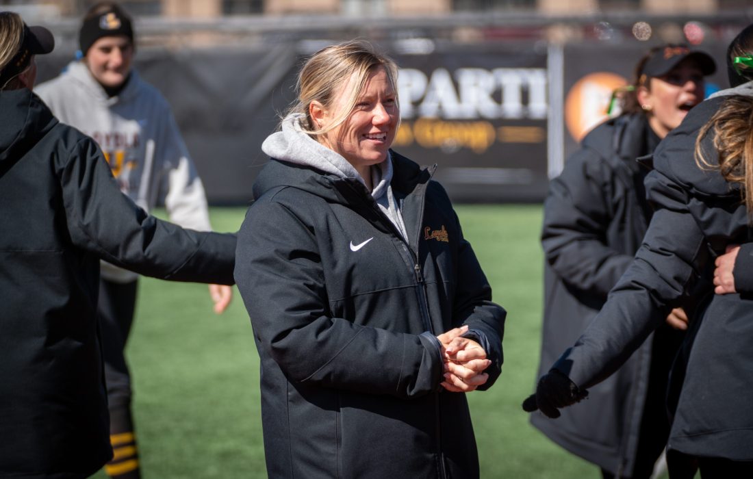 Abbott has built a philosophy within the team to prioritize "support  and community" (Courtesy of Loyola Athletics).