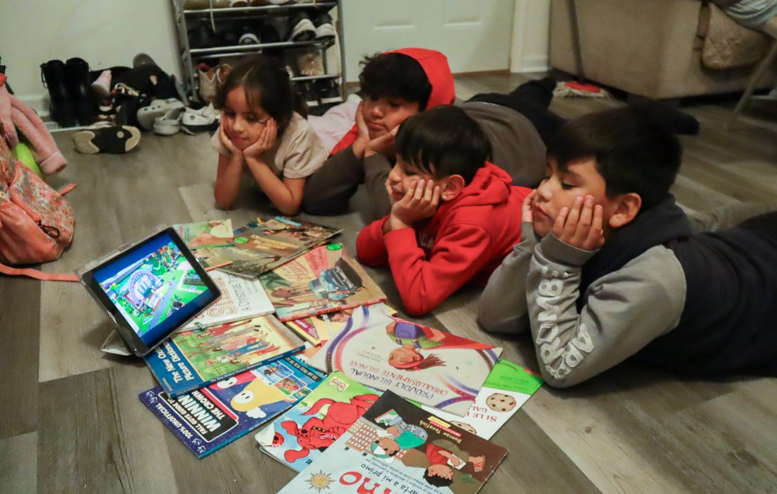 Children watch a show on the iPad with interest. (Ashley Wilson | The Phoenix)