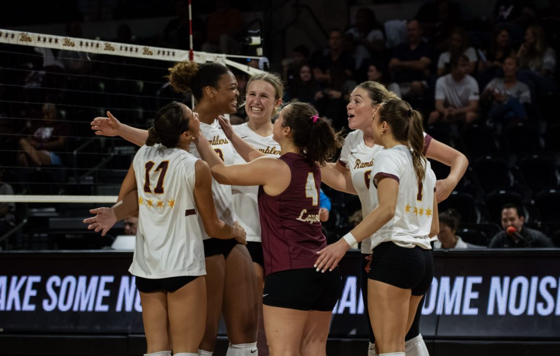 Loyola women's volleyball celebrates after a point. (Ayla Lee | Loyola Phoenix)
