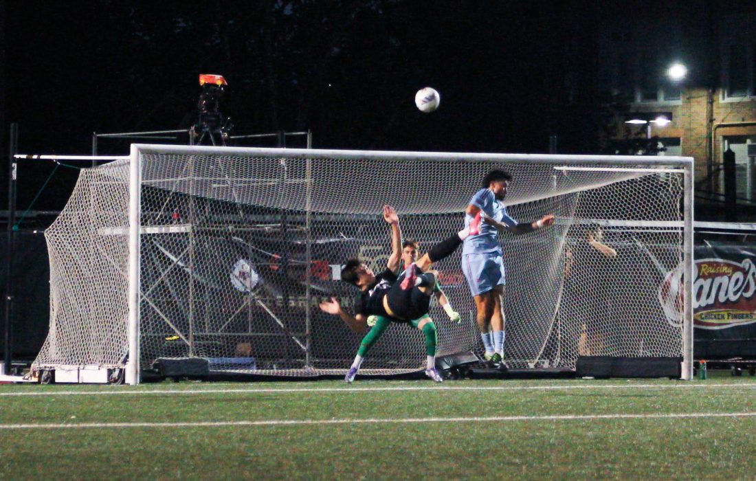 Urdiales performs a bicycle kick against UIC. (Bella Adams | The Phoenix)