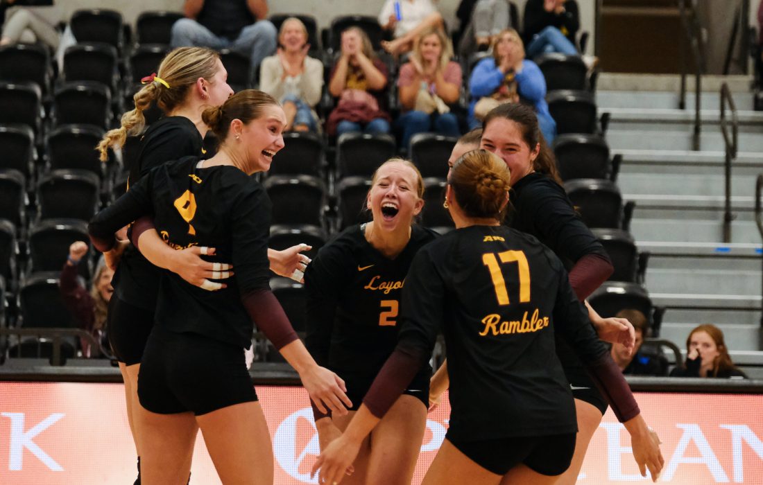 The Ramblers celebrate after winning a point in Friday night's match. (Caroline Clifford | The Phoenix)