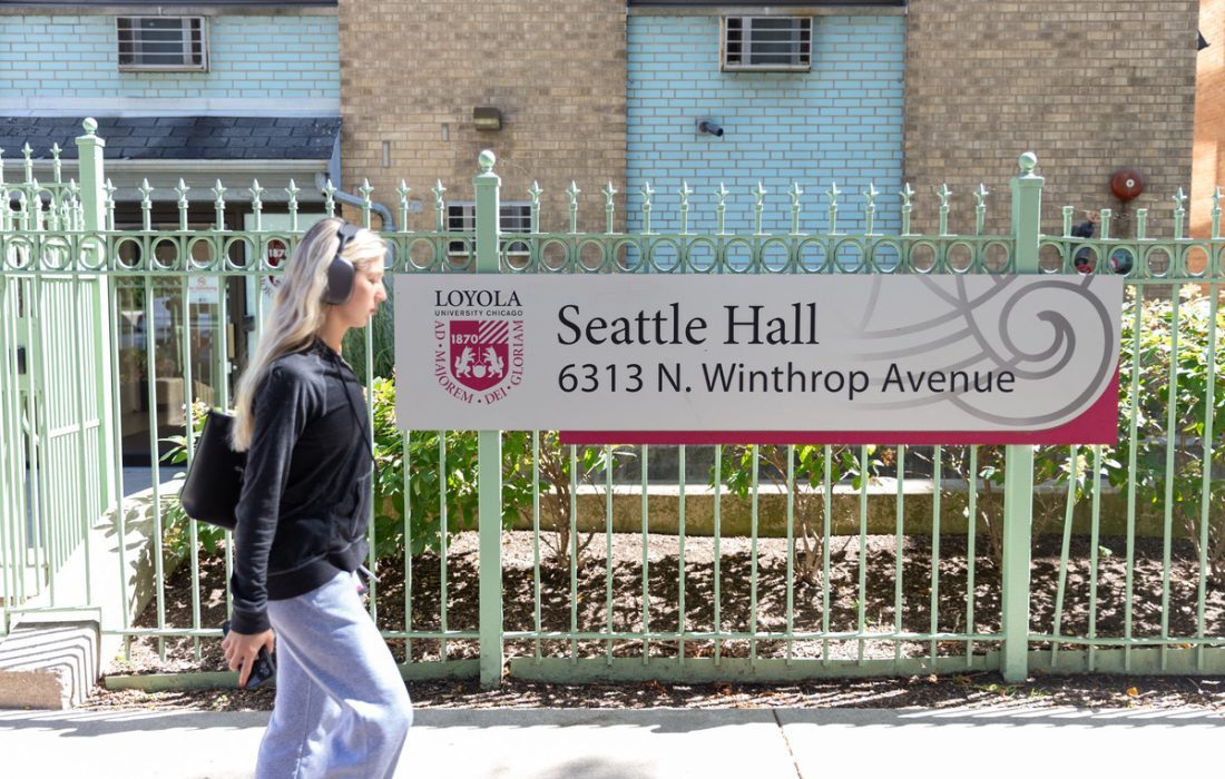 A student passes Seattle Hall on N. Winthrop Ave. (Hunter Minne | The Phoenix)
