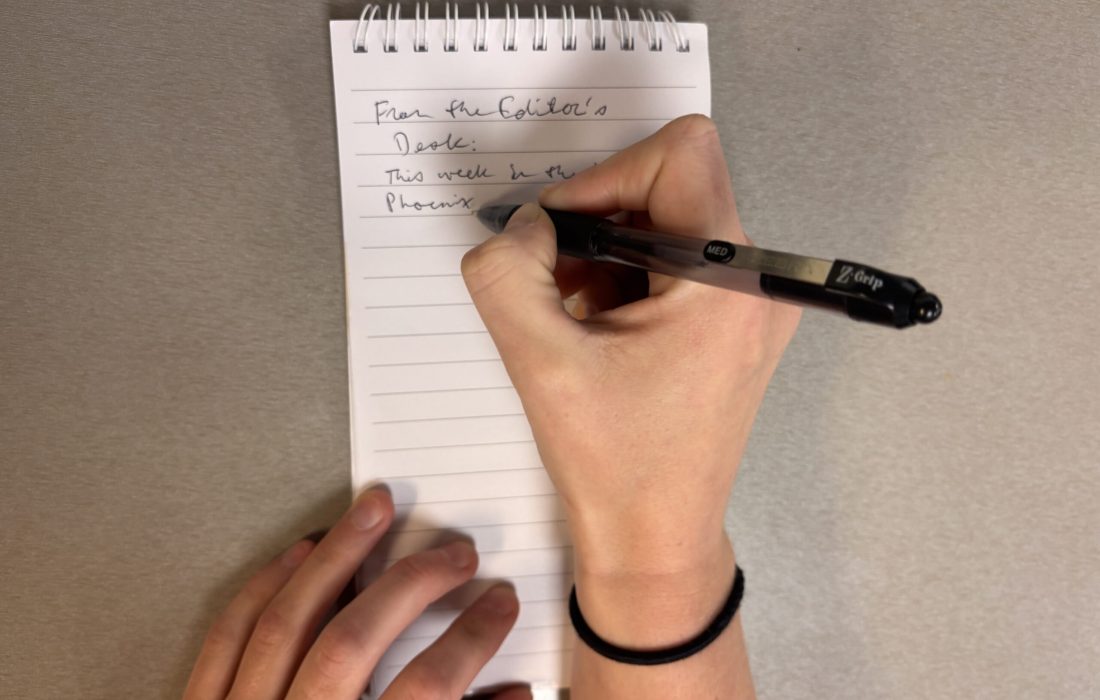 Editor-in-Chief Julia Pentasuglio drafts her weekly "From the Editor's Desk" article. (Faith Hug | The Phoenix)