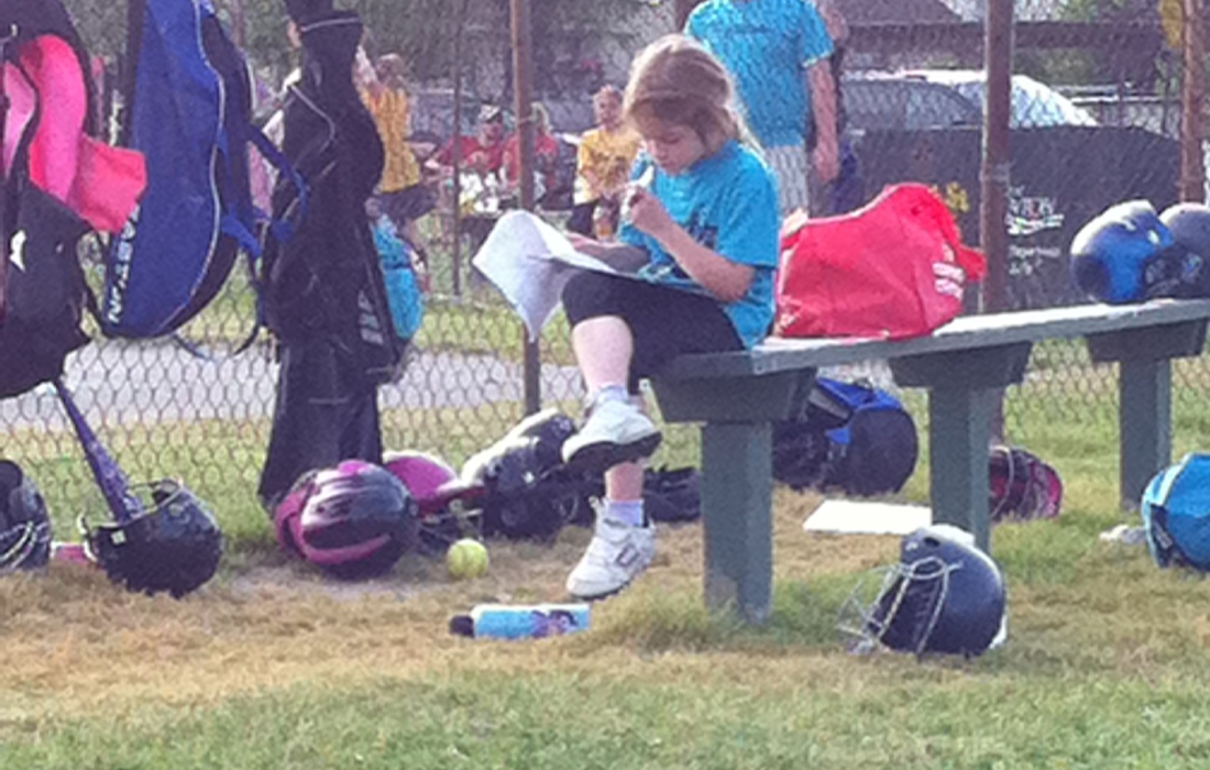 Revesz scoring her softball game when she was seven. (Courtesy of Andi Revesz)