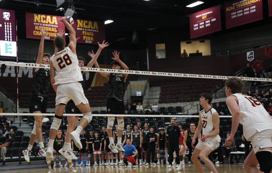 Fabikovic spikes the ball over the net. (Lilli Malone | The Phoenix)