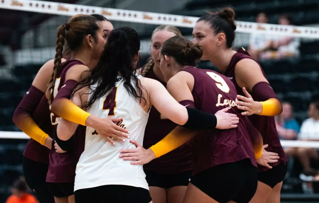 The Ramblers come together before a point in their three-set win. (Courtesy of Loyola Athletics)