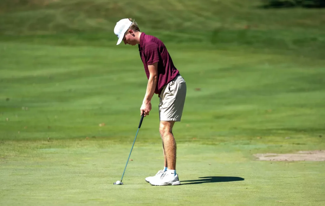 Third-year Connor Woodin preps for a putt. (Courtesy of Loyola Athletics)