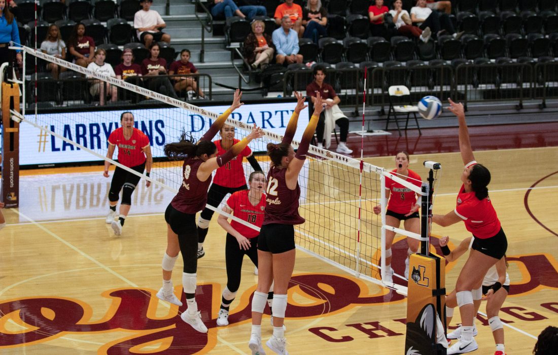 Remmes and Halbleib block an incoming pass. (Megan Dunn | The Phoenix)