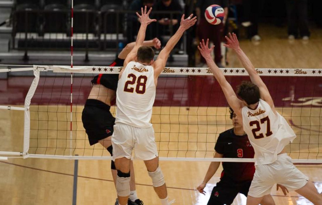 Fabikovic and Klein team up for a block. (Megan Dunn | The Phoenix)