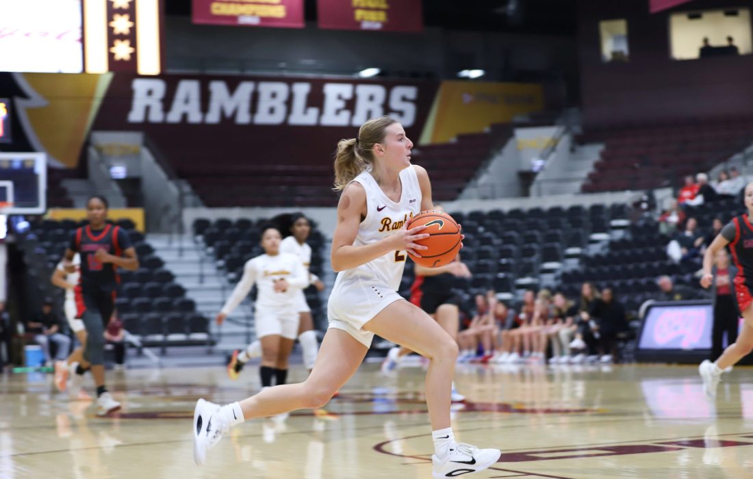 Kinas drives towards the basket. (Niko Zvodinsky | The Phoenix)