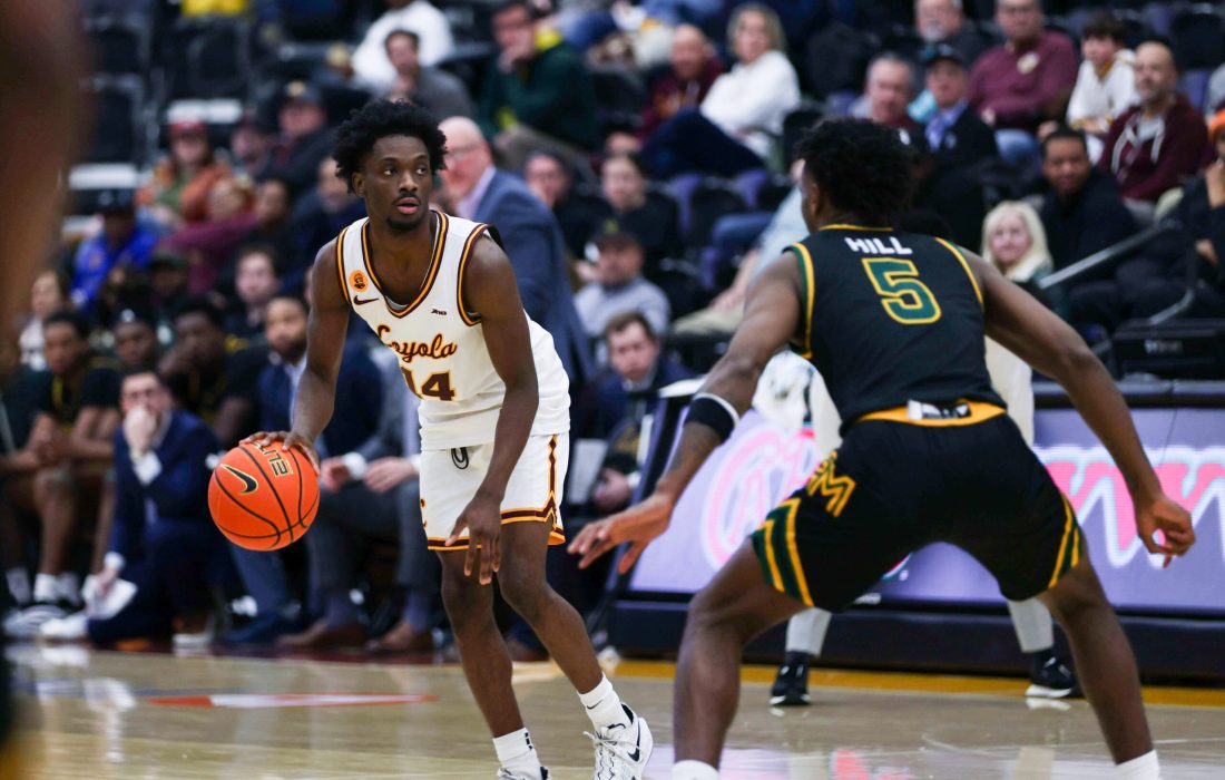 Reese in the point guard position against George Mason. (Norman Tiedemann | The Phoenix)