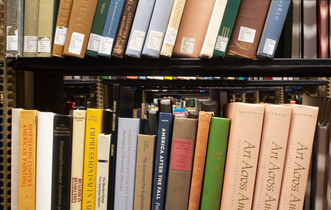 Art History books sit on a shelf in Cudahy Library. (Quinton Palmer | The Phoenix)
