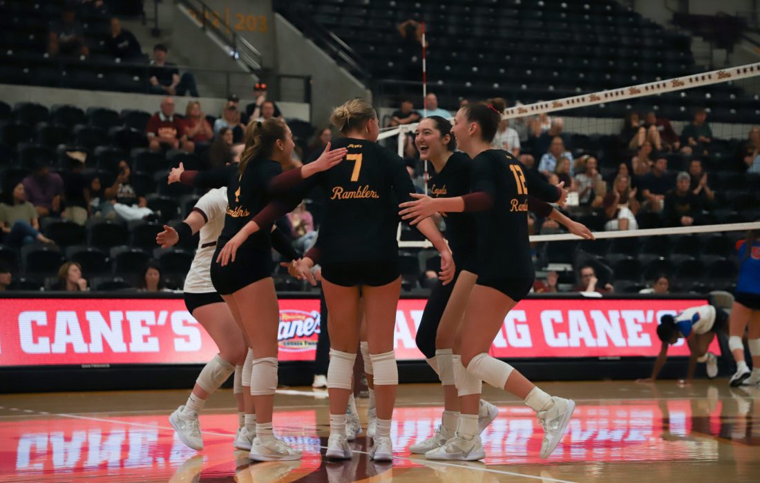 The Ramblers celebrate after a point during the five set thriller. (Rania Woodward | The Phoenix)