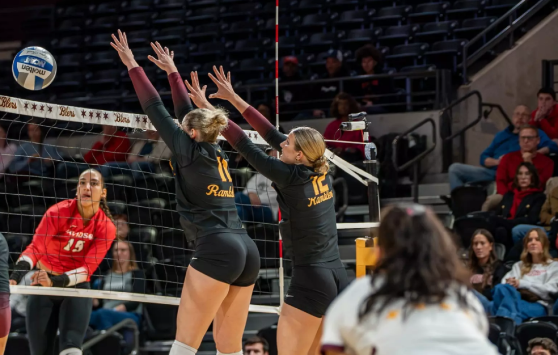 Third-year middle blocker Chloe Morgan and second-year right side Katie Scherer in action. (Courtesy of Loyola Athletics)