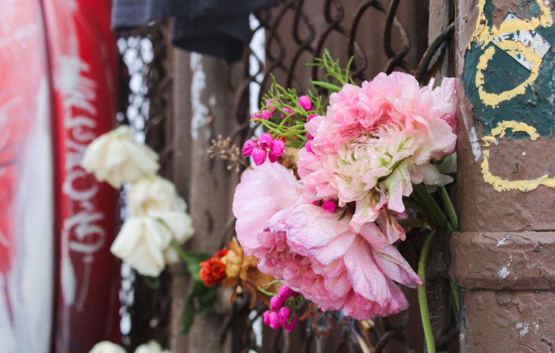 Students placed flowers at the pier at Loyola Beach to honor Sheridan Gorman's death. (Sophia Reass / The Phoenix)
