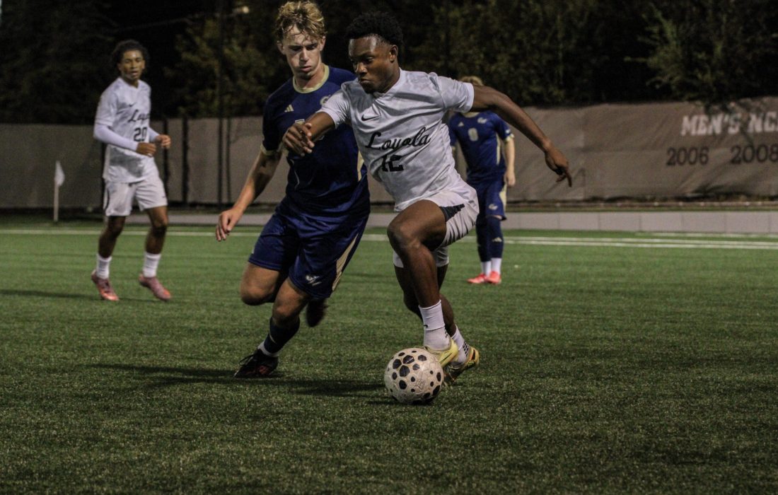 Second-year forward Chimnosoh Okeke battles a George Washington defender. (Sophia Reass | The Phoenix)