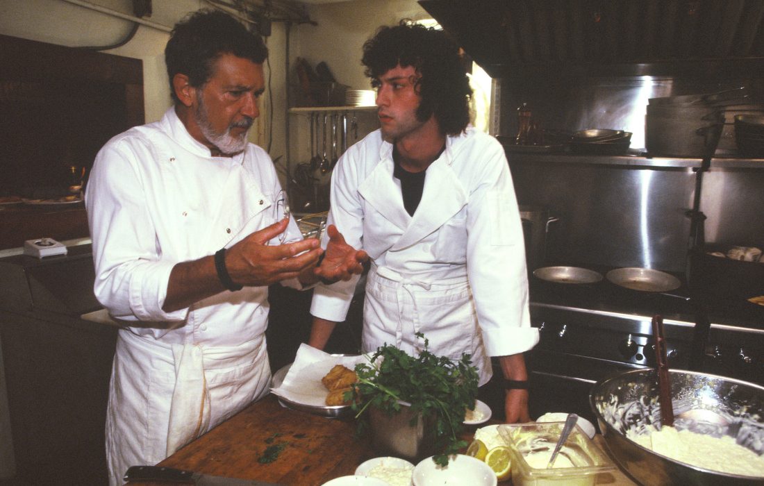 Dominic Sessa's young Tony is kept under the watchful eye of his chef mentor, played by Antonio Banderas. (Courtesy of A24)