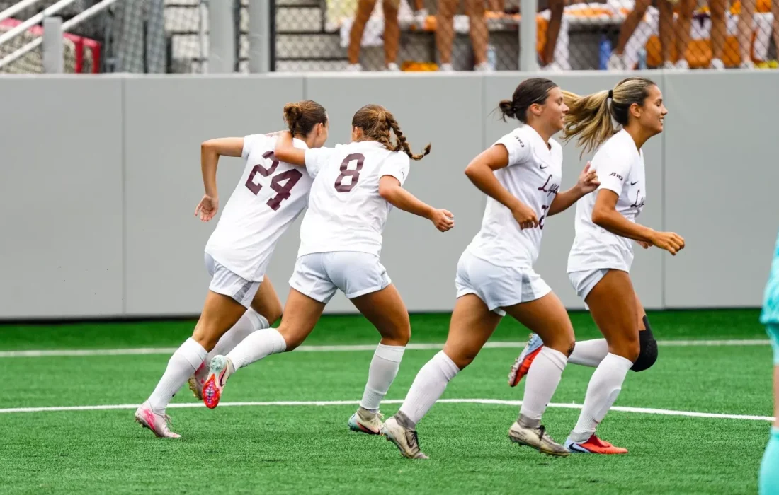 Ramblers celebrate after a goal. (Courtesy of Loyola Athletics)
