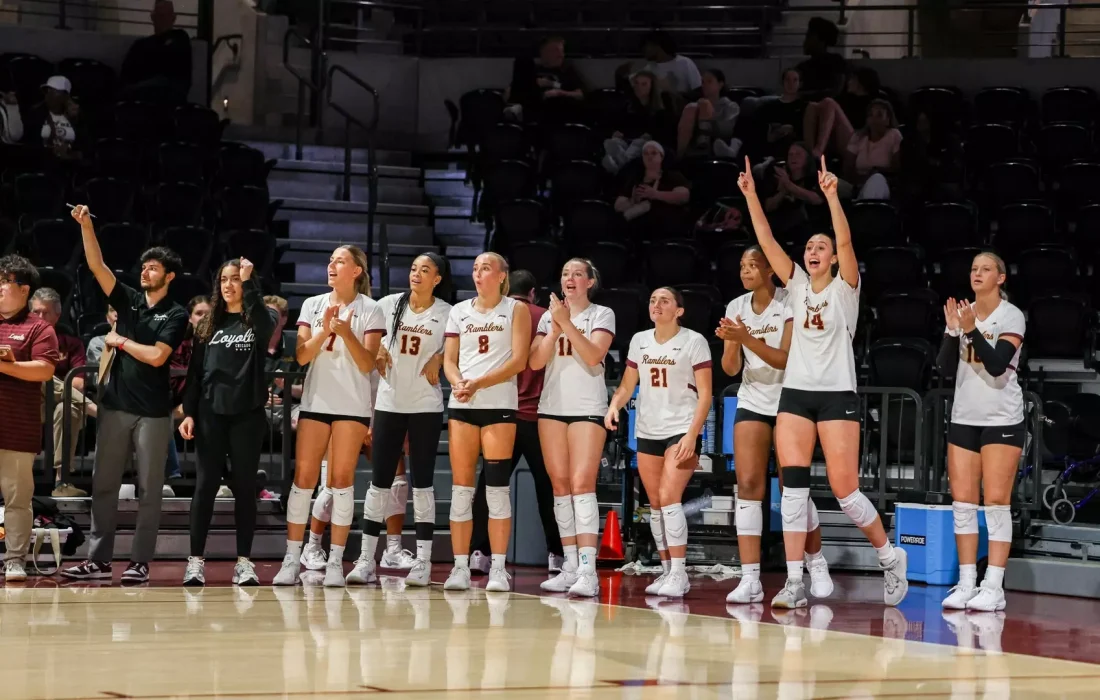 Women's volleyball celebrates a point. (Courtesy of Loyola Athletics)