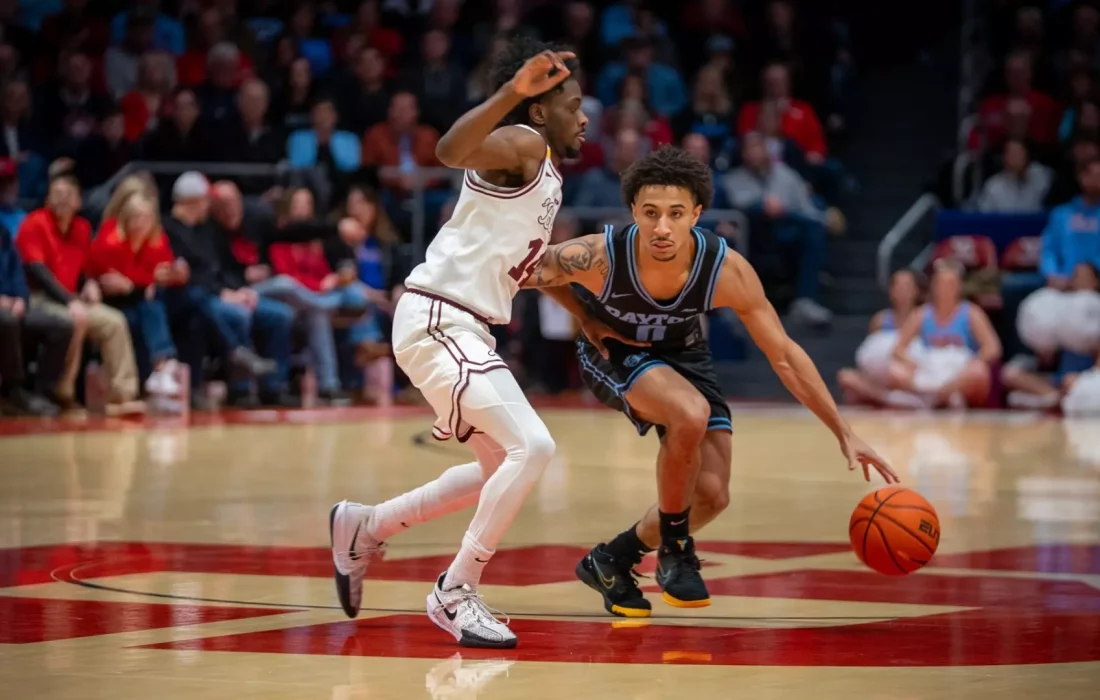 Reese guards Bennett as he drives towards the net. (Courtesy of Loyola Athletics)