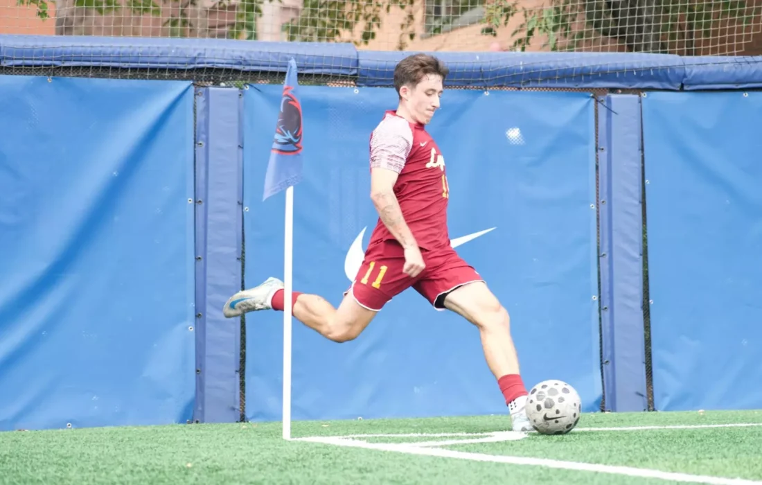 Third-year midfielder Jack McFeely takes a corner kick for Loyola. (Courtesy of Anjelo Evans | Loyola Athletics)