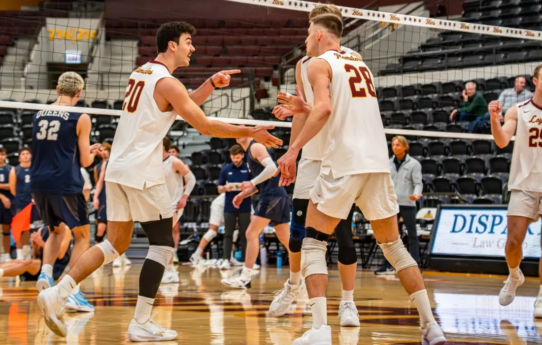 Schellinger and Fabikovic celebrate after a point. (Courtesy of Loyola Athletics)
