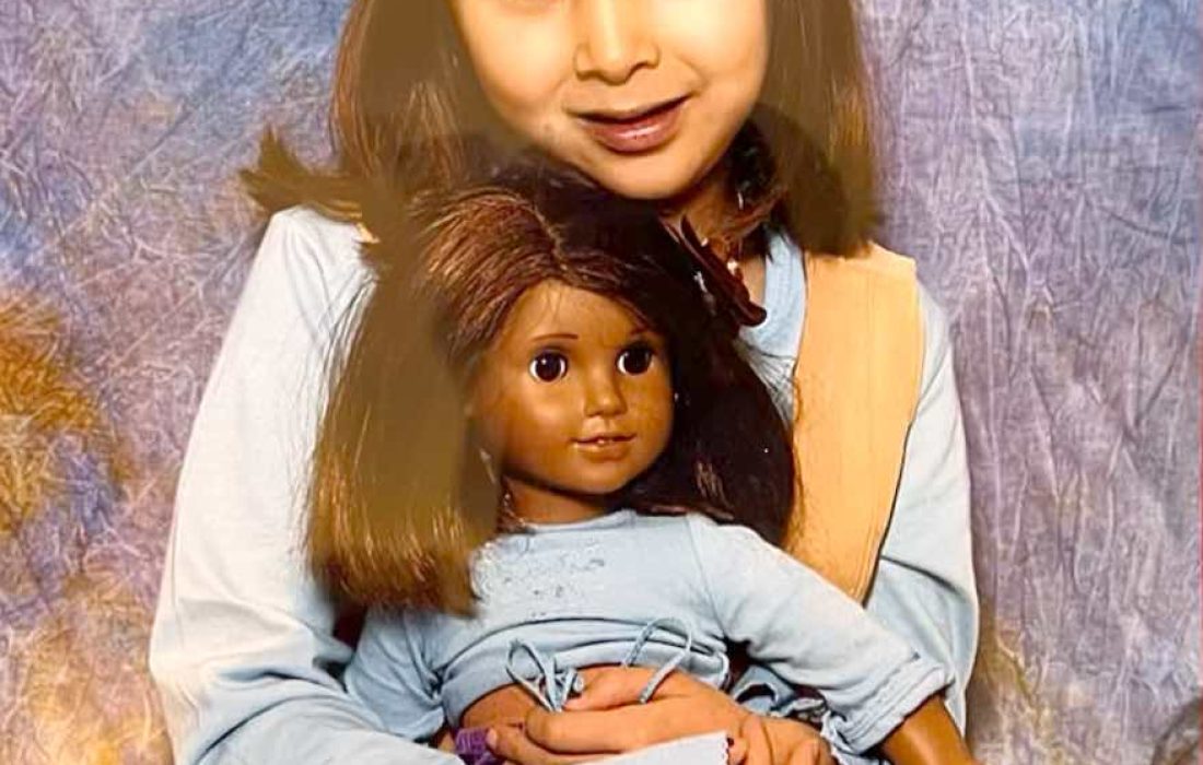Young San Miguel poses with an American Girl doll. (Courtesy of Anna San Miguel)