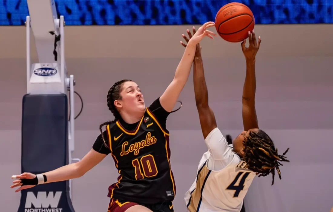 Bessette blocks a shot attempt. (Courtesy of Loyola Athletics)